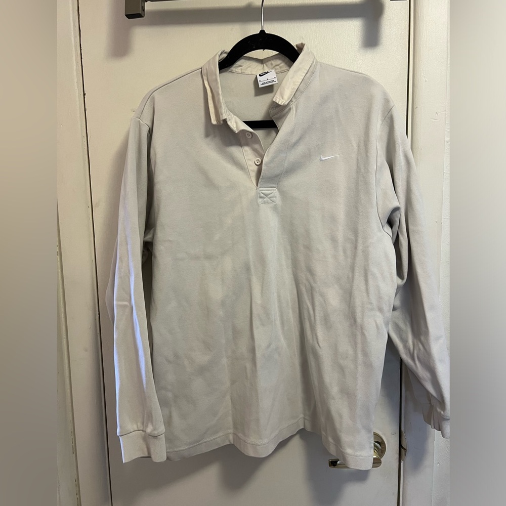 Size M men’s long sleeved collared white Nike shirt